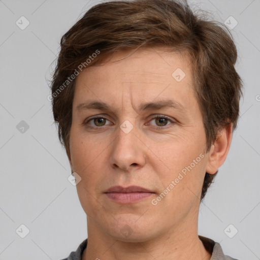 Joyful white adult male with short  brown hair and grey eyes