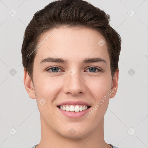 Joyful white young-adult female with short  brown hair and grey eyes