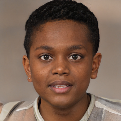 Joyful black child male with short  brown hair and brown eyes