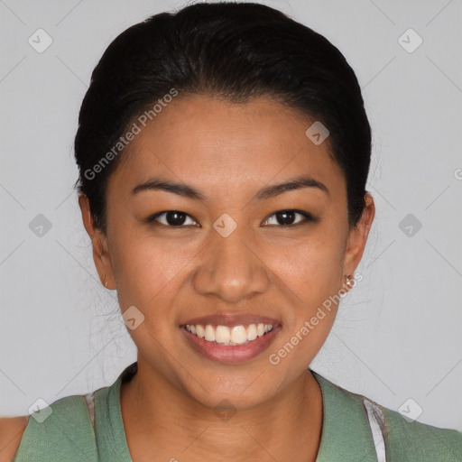 Joyful latino young-adult female with short  brown hair and brown eyes