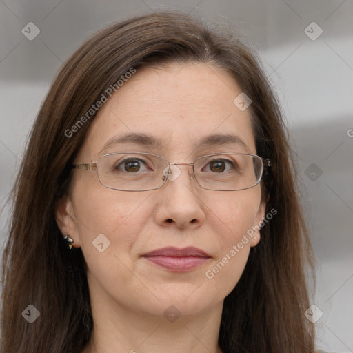 Joyful white adult female with long  brown hair and grey eyes