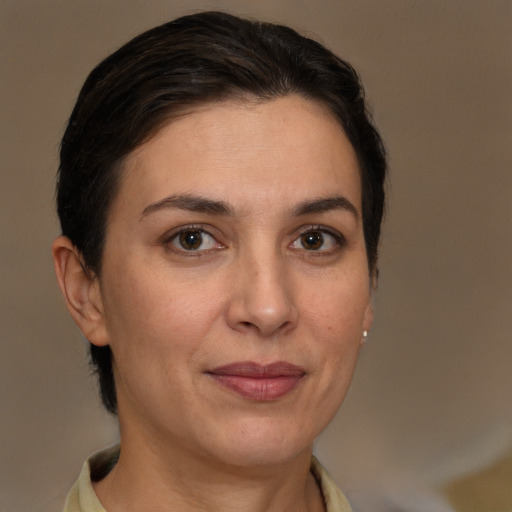 Joyful white adult female with short  brown hair and brown eyes