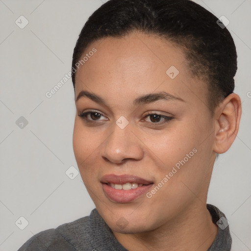 Joyful black young-adult female with short  brown hair and brown eyes