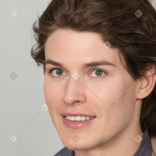 Joyful white young-adult female with medium  brown hair and green eyes