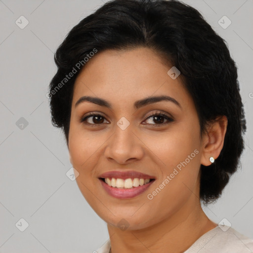 Joyful latino young-adult female with medium  brown hair and brown eyes