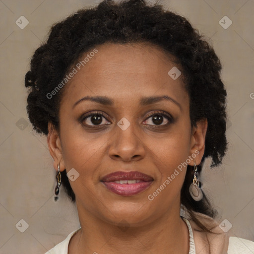 Joyful black adult female with medium  brown hair and brown eyes