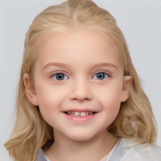 Joyful white child female with medium  blond hair and blue eyes