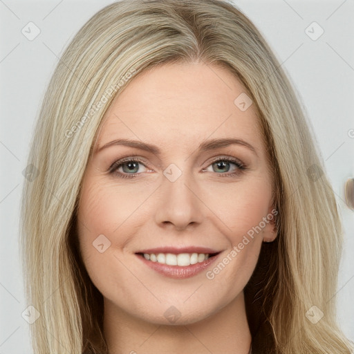 Joyful white young-adult female with long  brown hair and blue eyes