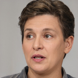 Joyful white adult female with short  brown hair and brown eyes