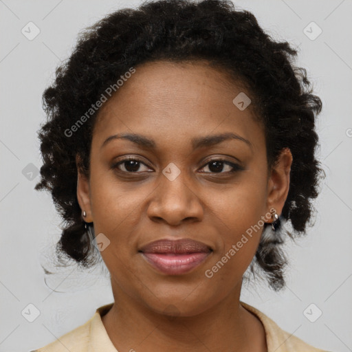 Joyful black adult female with medium  brown hair and brown eyes