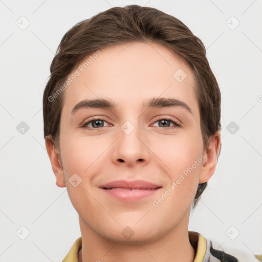 Joyful white young-adult female with short  brown hair and grey eyes