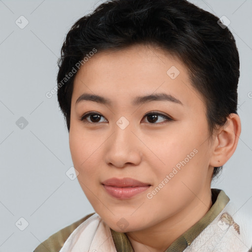 Joyful asian young-adult female with short  brown hair and brown eyes