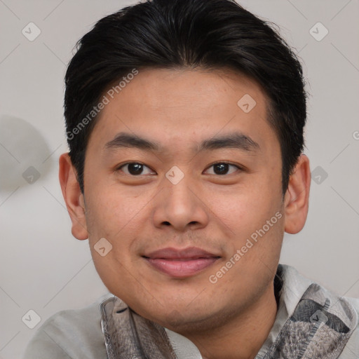 Joyful asian young-adult male with short  brown hair and brown eyes