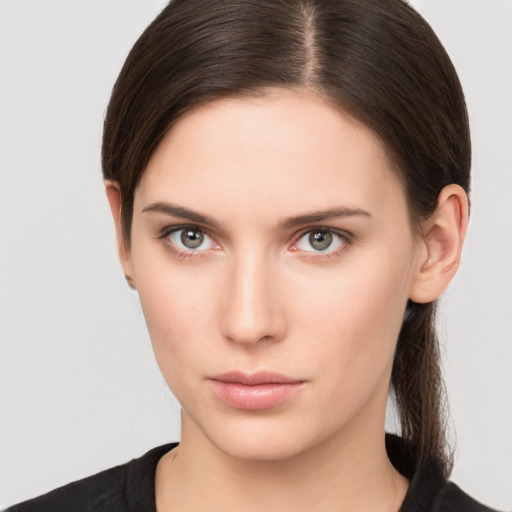 Neutral white young-adult female with medium  brown hair and brown eyes