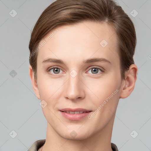 Joyful white young-adult female with short  brown hair and grey eyes