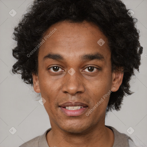 Joyful black young-adult male with short  black hair and brown eyes