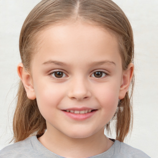 Joyful white child female with medium  brown hair and grey eyes