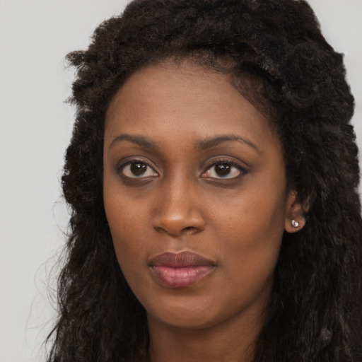 Neutral black young-adult female with long  black hair and brown eyes