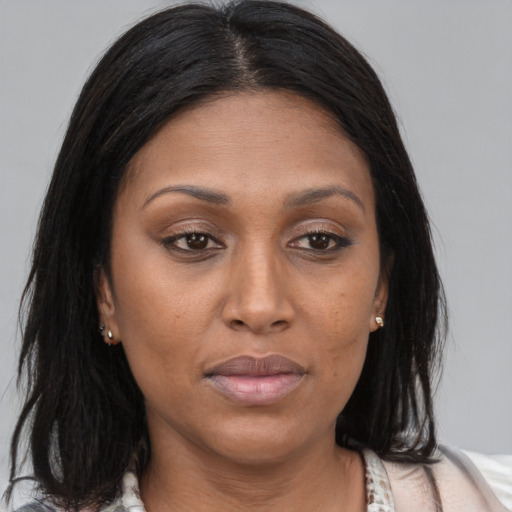 Joyful asian adult female with long  brown hair and brown eyes
