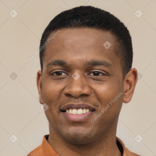 Joyful black young-adult male with short  black hair and brown eyes