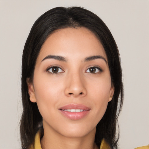 Joyful white young-adult female with long  black hair and brown eyes