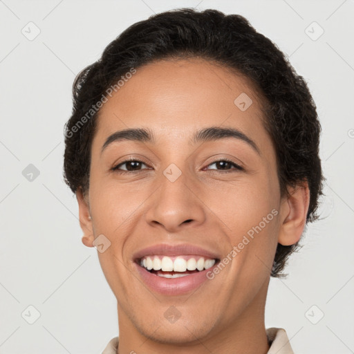 Joyful latino young-adult female with short  brown hair and brown eyes