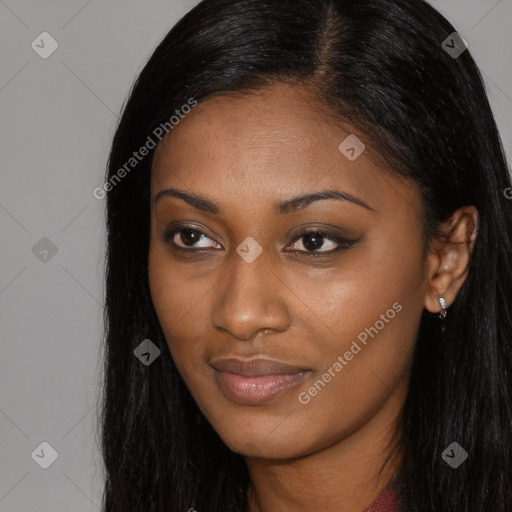 Joyful black young-adult female with long  black hair and brown eyes