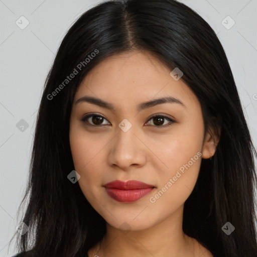 Joyful latino young-adult female with long  brown hair and brown eyes