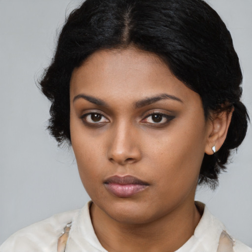 Neutral latino young-adult female with medium  black hair and brown eyes