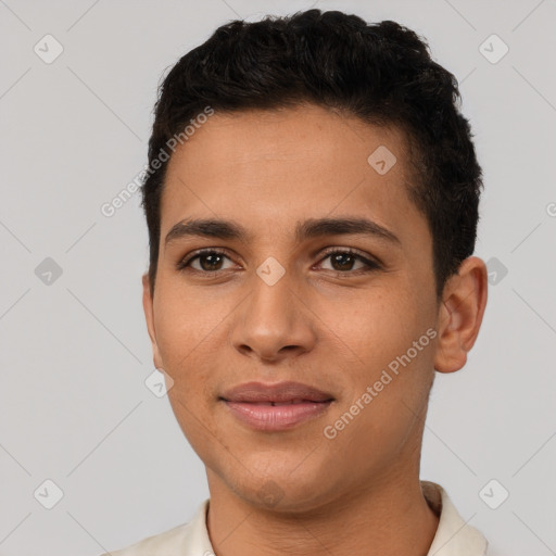 Joyful latino young-adult male with short  brown hair and brown eyes