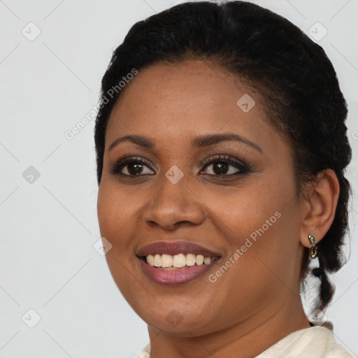 Joyful black young-adult female with short  brown hair and brown eyes