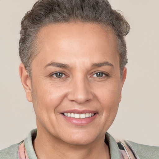 Joyful white adult female with short  brown hair and brown eyes