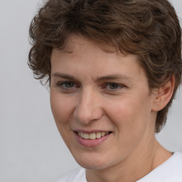 Joyful white young-adult male with medium  brown hair and brown eyes