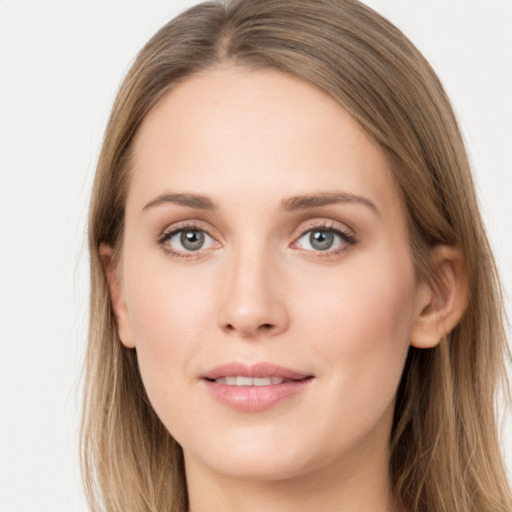 Joyful white young-adult female with long  brown hair and grey eyes