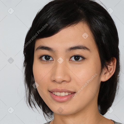 Joyful asian young-adult female with medium  brown hair and brown eyes