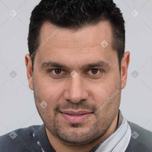 Joyful white adult male with short  brown hair and brown eyes