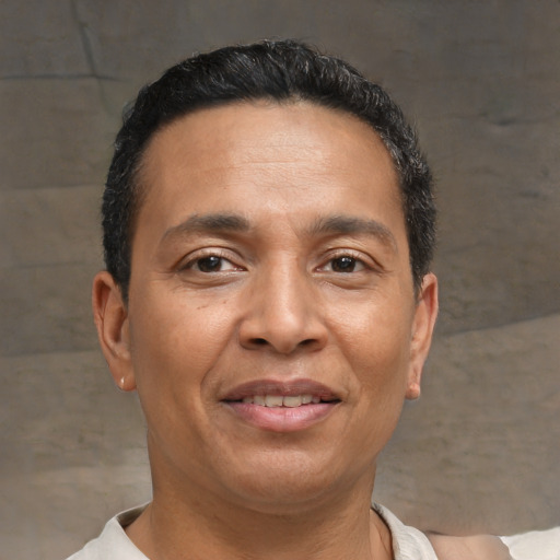 Joyful asian adult male with short  brown hair and brown eyes