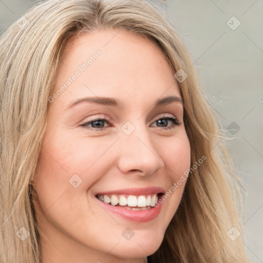 Joyful white young-adult female with long  brown hair and blue eyes