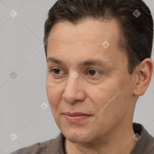 Joyful white adult male with short  brown hair and brown eyes