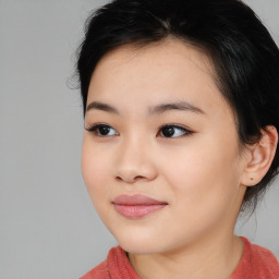 Joyful asian young-adult female with long  brown hair and brown eyes