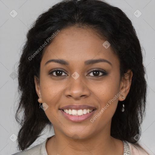 Joyful black young-adult female with long  brown hair and brown eyes