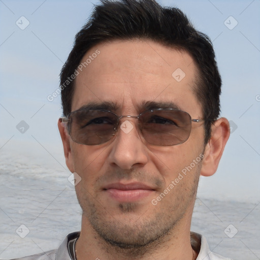 Joyful white adult male with short  brown hair and brown eyes