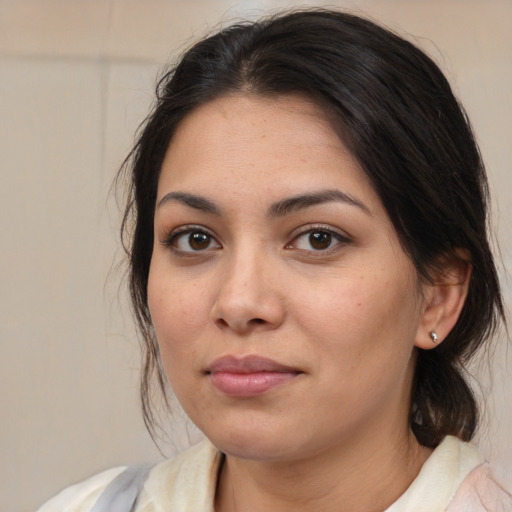Joyful white young-adult female with medium  brown hair and brown eyes