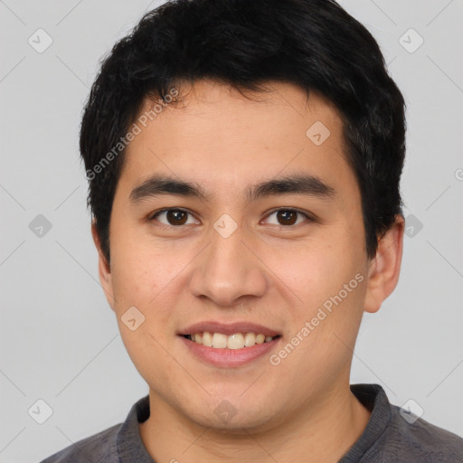 Joyful white young-adult male with short  black hair and brown eyes