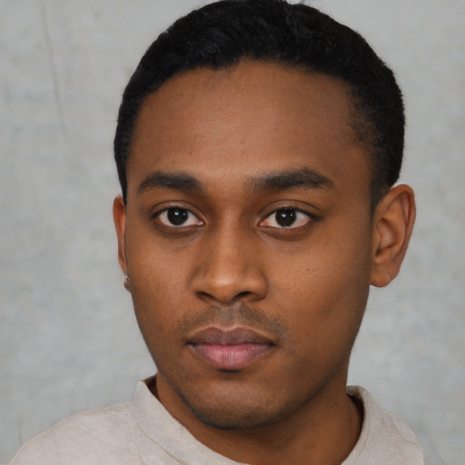Neutral black young-adult male with short  black hair and brown eyes