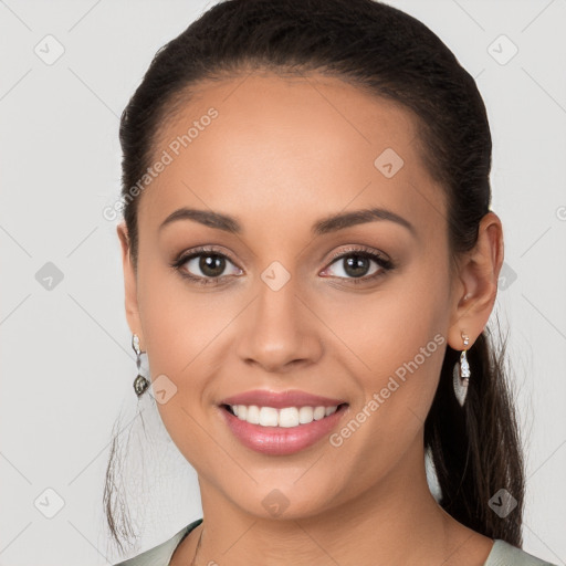 Joyful white young-adult female with long  brown hair and brown eyes