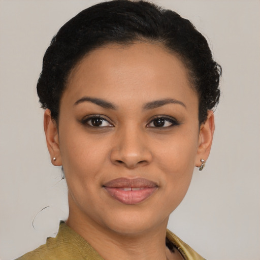 Joyful black young-adult female with short  brown hair and brown eyes