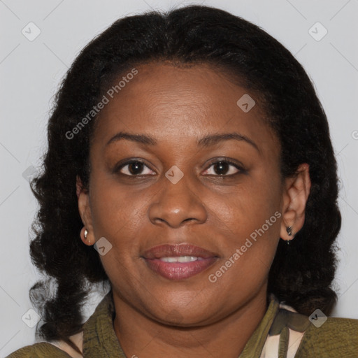 Joyful black young-adult female with medium  brown hair and brown eyes