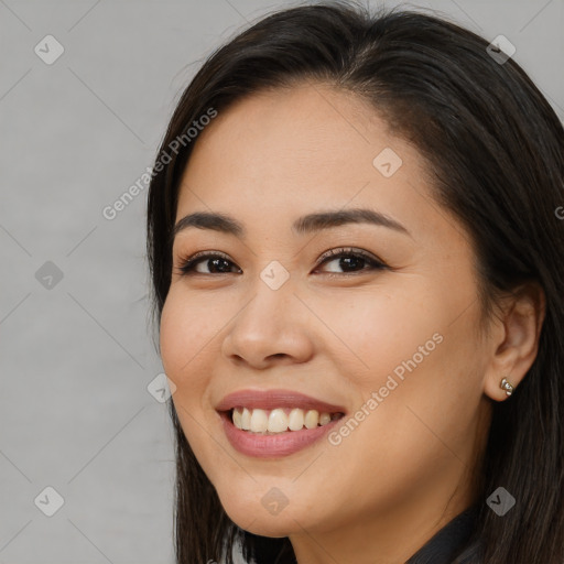 Joyful white young-adult female with long  brown hair and brown eyes