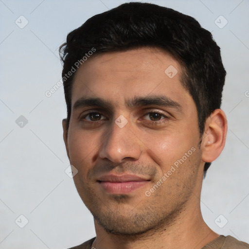 Joyful white young-adult male with short  black hair and brown eyes